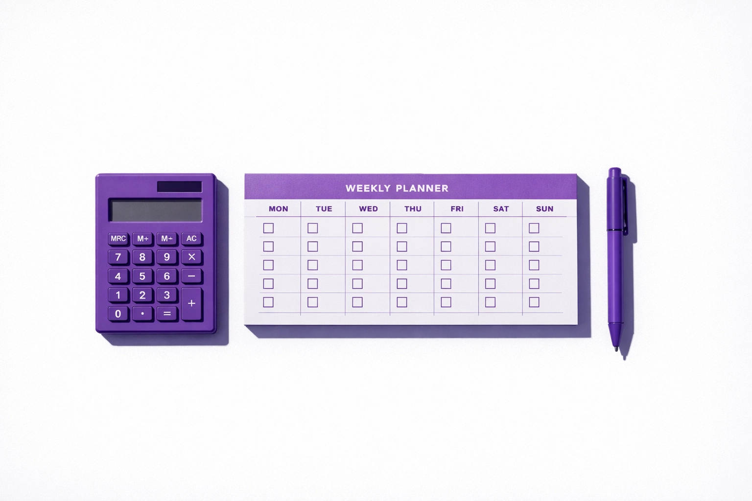 Organized desk with calculator and weekly planner for bookkeeping transition tasks
